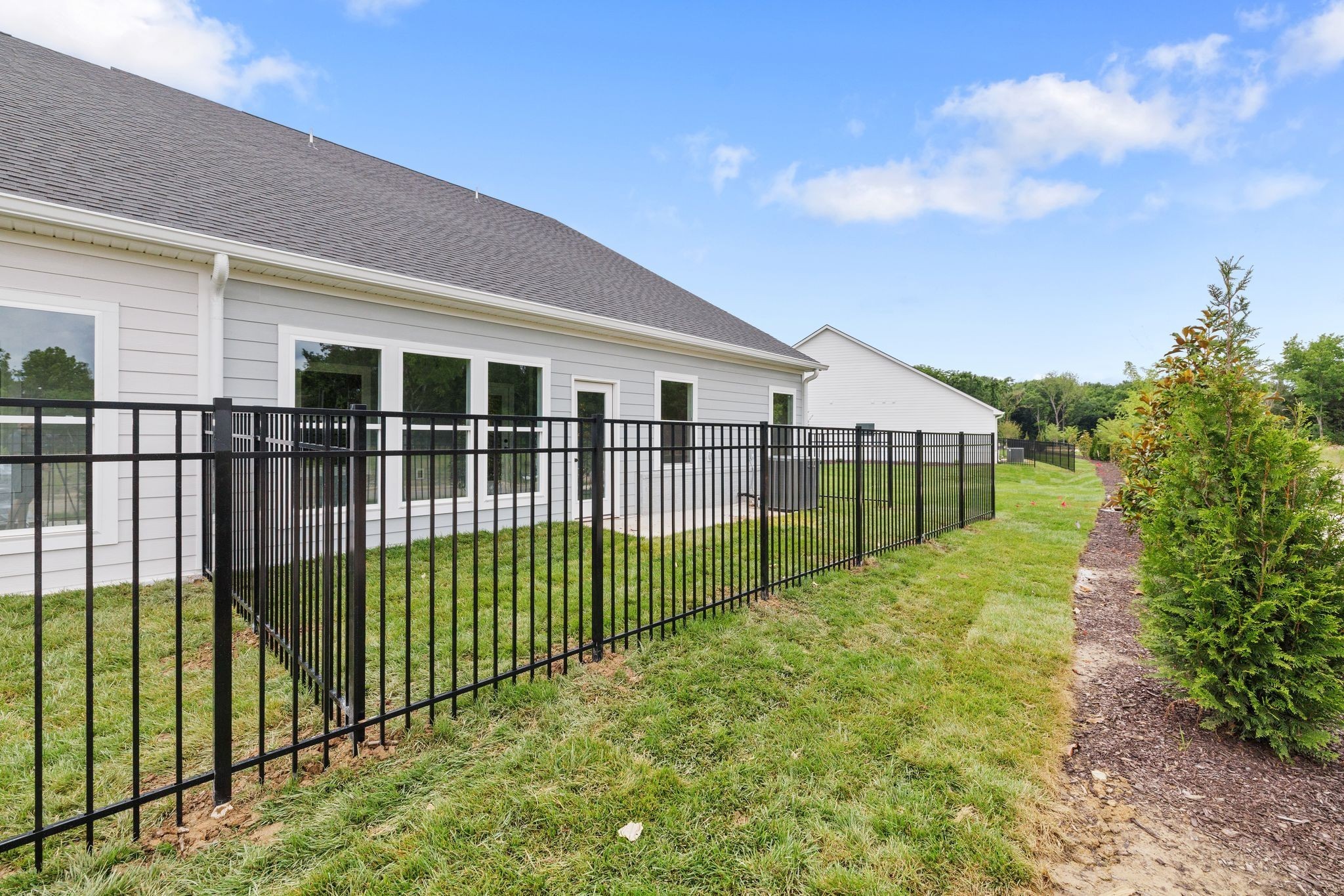 2039 Grace Johns Circle Murfreesboro, TN 37128 - Photo 31 of 33 a view of a garden with brick wall