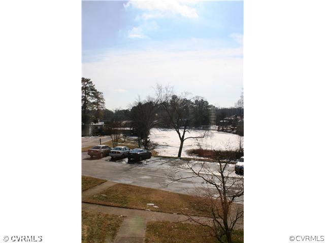 9 Waterfall Road, Unit 9 Henrico, VA 23228 - Photo 16 of 17 Exterior Back - View of Pond and Swimming Pool from Patio and Master Bedroom.