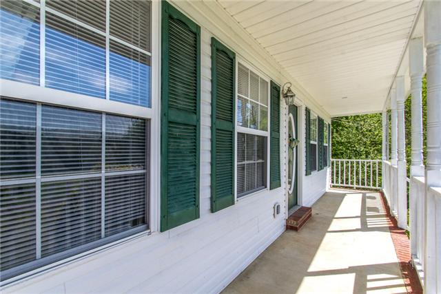 1078 Bakers Work Road Burns, TN 37029 - Photo 14 of 20 Long Covered Front Porch