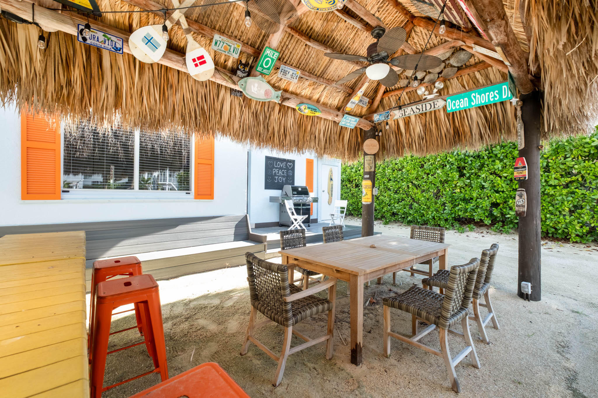 181 Ocean View Drive Key Largo, FL 33037 - Photo 19 of 52 a view of a patio with table and chairs and potted plants
