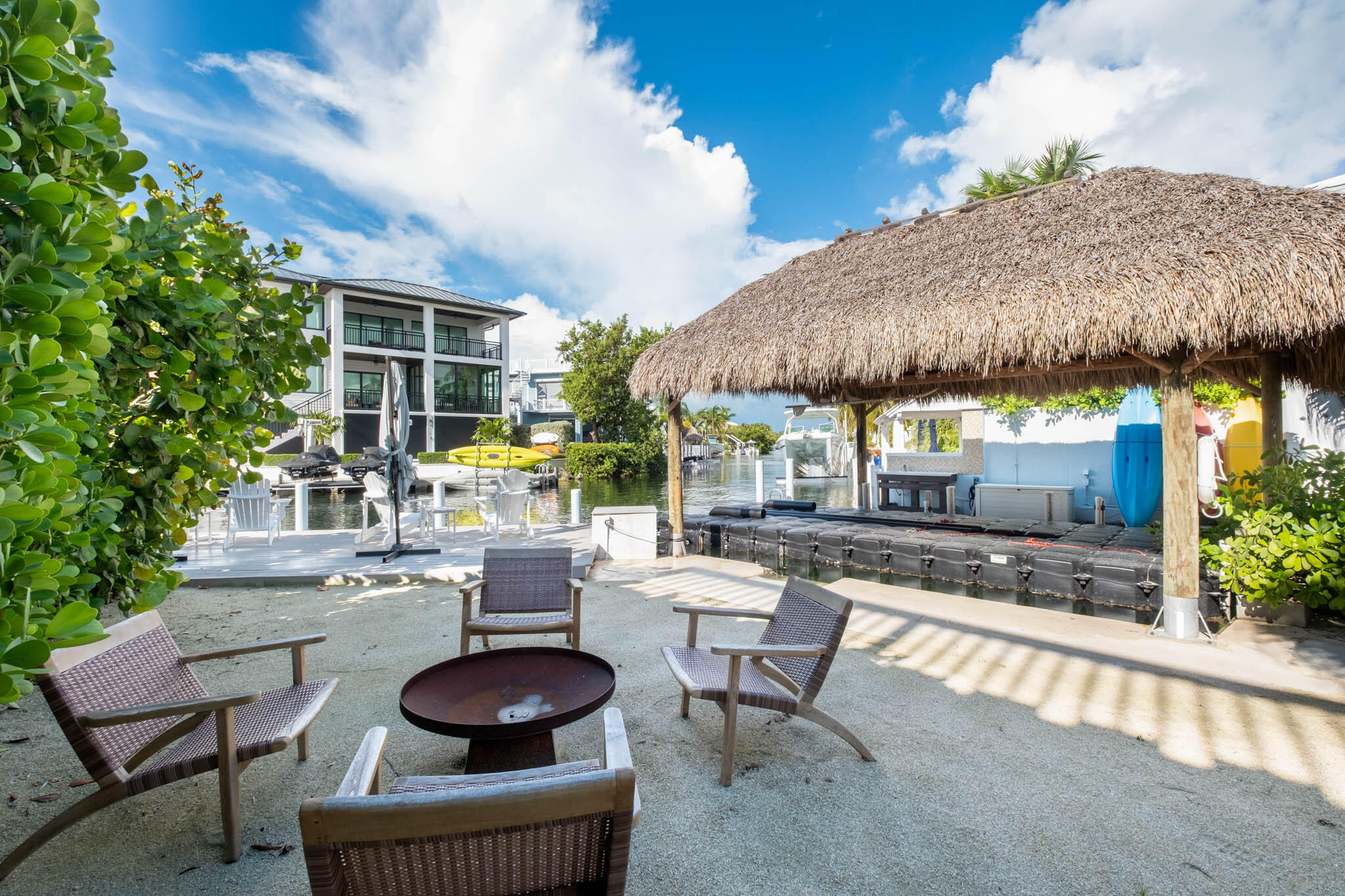 181 Ocean View Drive Key Largo, FL 33037 - Photo 23 of 52 a patio with patio a fire pit and outdoor seating