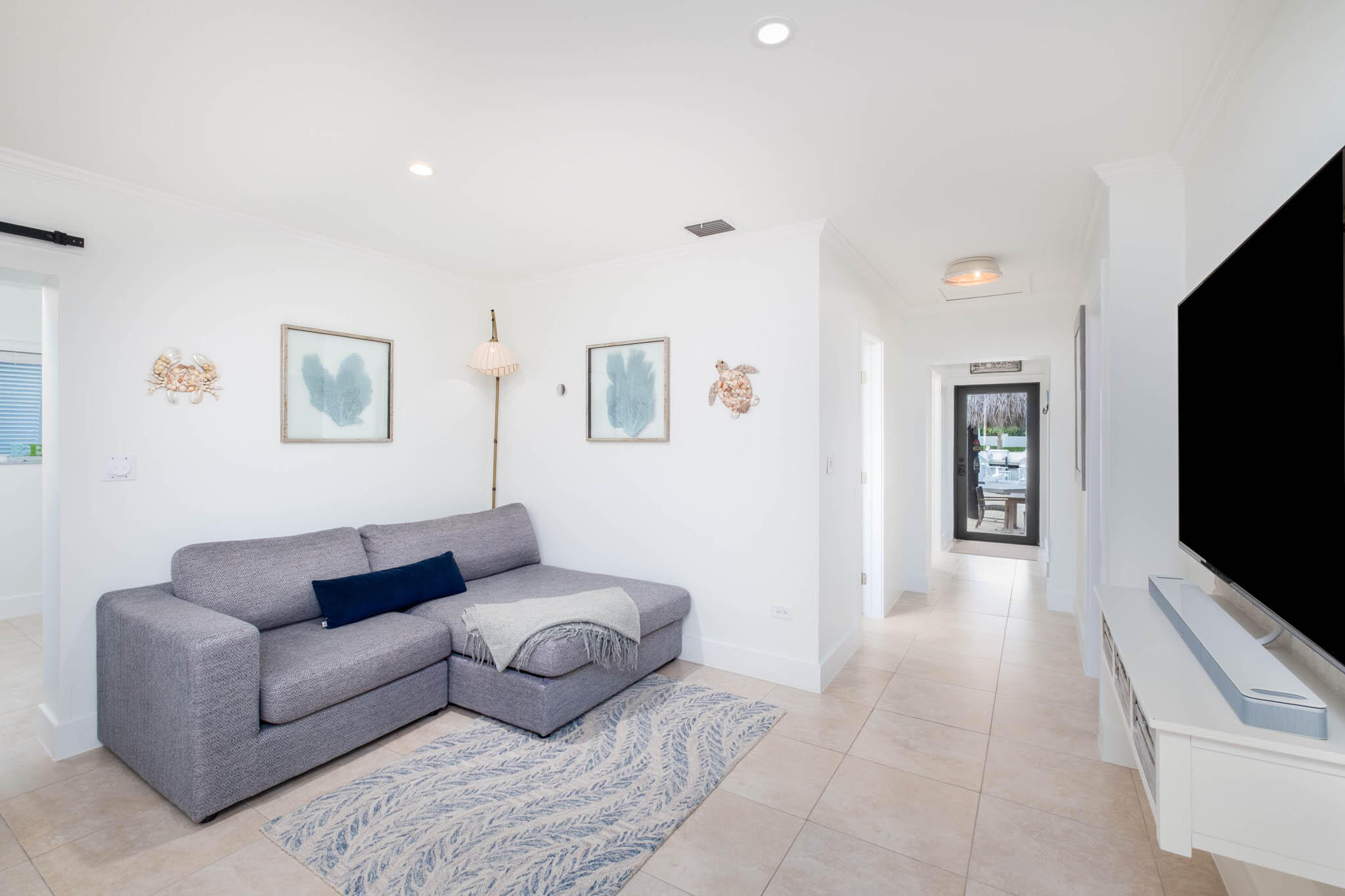 181 Ocean View Drive Key Largo, FL 33037 - Photo 32 of 52 a living room with furniture and a flat screen tv
