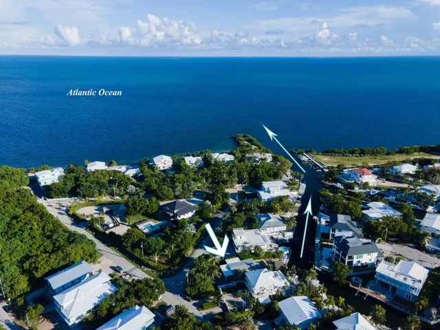 a aerial view of a house with table and chairs