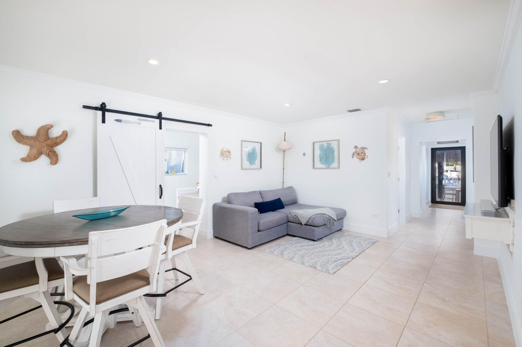 181 Ocean View Drive Key Largo, FL 33037 - Photo 34 of 52 a living room with furniture and a table