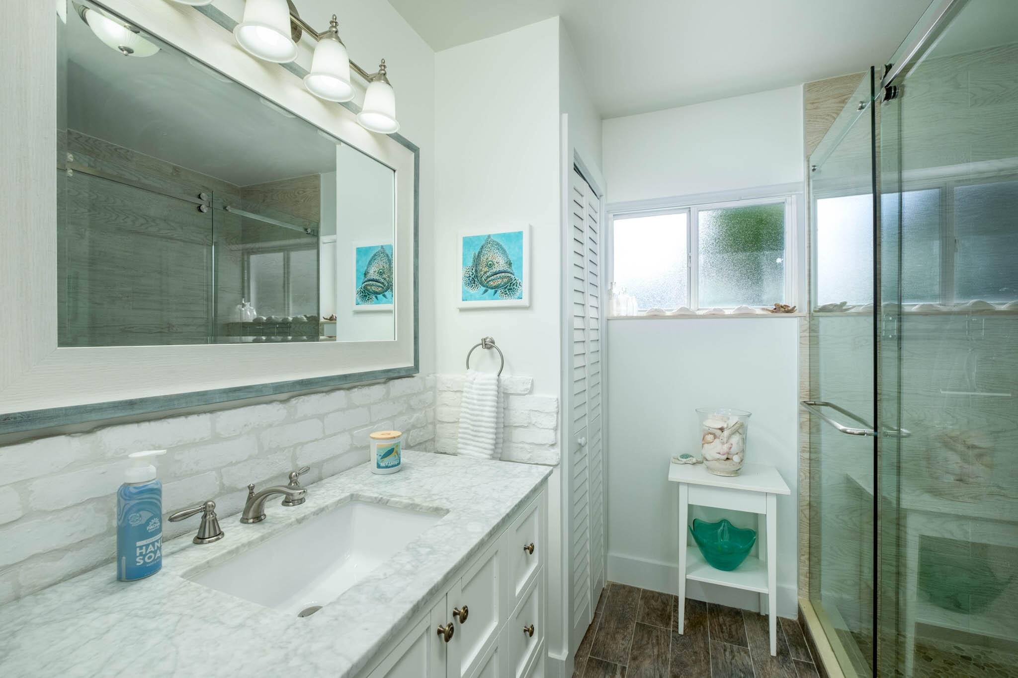 181 Ocean View Drive Key Largo, FL 33037 - Photo 39 of 52 a bathroom with a granite countertop sink a toilet and a mirror