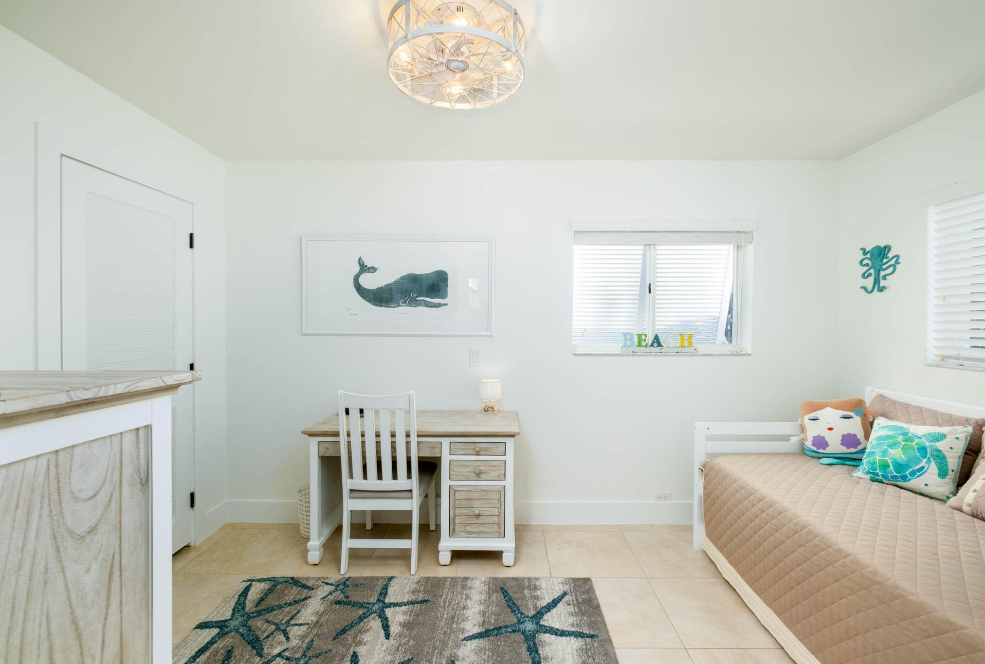 181 Ocean View Drive Key Largo, FL 33037 - Photo 43 of 52 a bedroom with a bed and a table in it