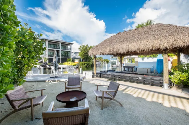 a lake view with a seating space and a garden