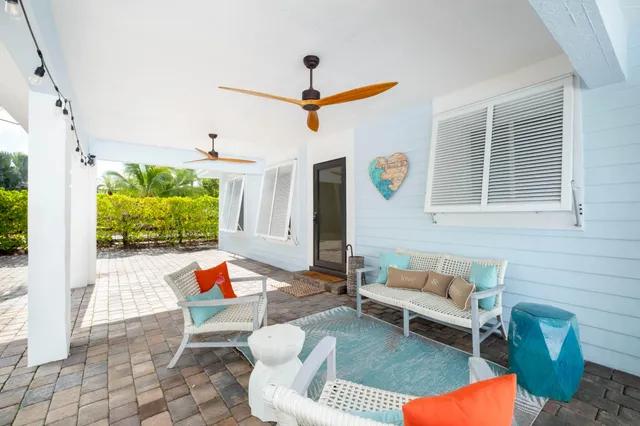 a outdoor living space with furniture and a potted plant