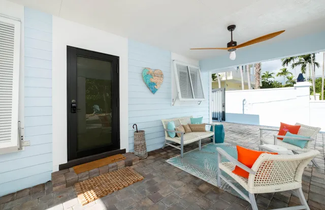 a outdoor living space with furniture and a rug