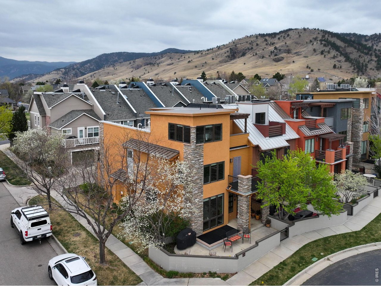 a aerial view of a house with a yard and balcony