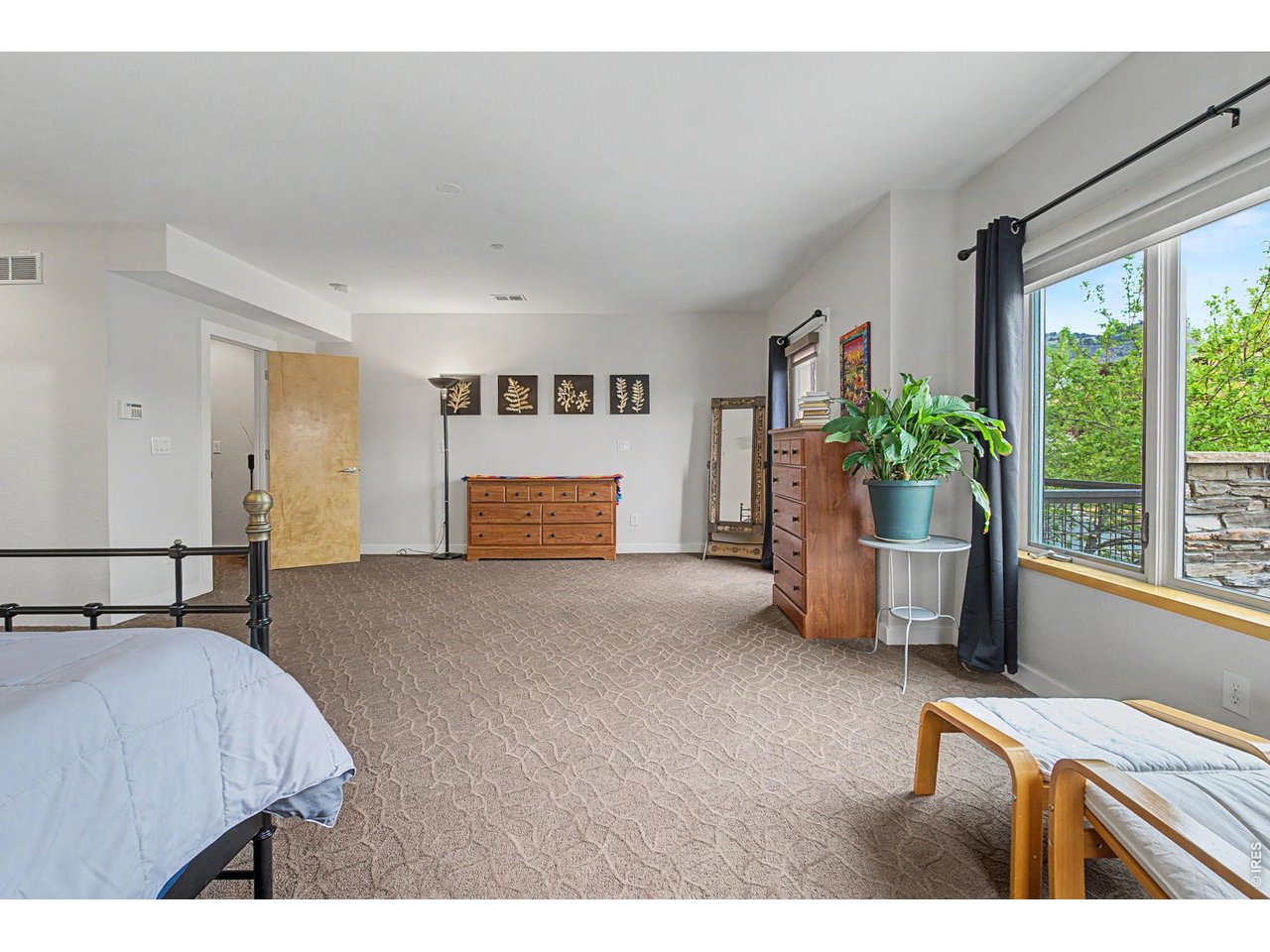 5055 Ralston Street, Unit A Boulder, CO 80304 - Photo 16 of 50 a bedroom with furniture and windows