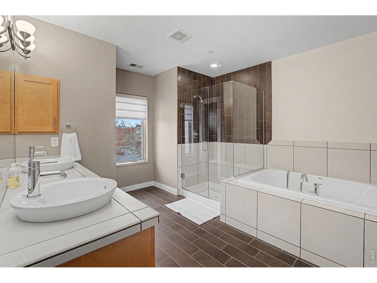 5055 Ralston Street, Unit A Boulder, CO 80304 - Photo 17 of 50 a bathroom with a sink double vanity and a mirror