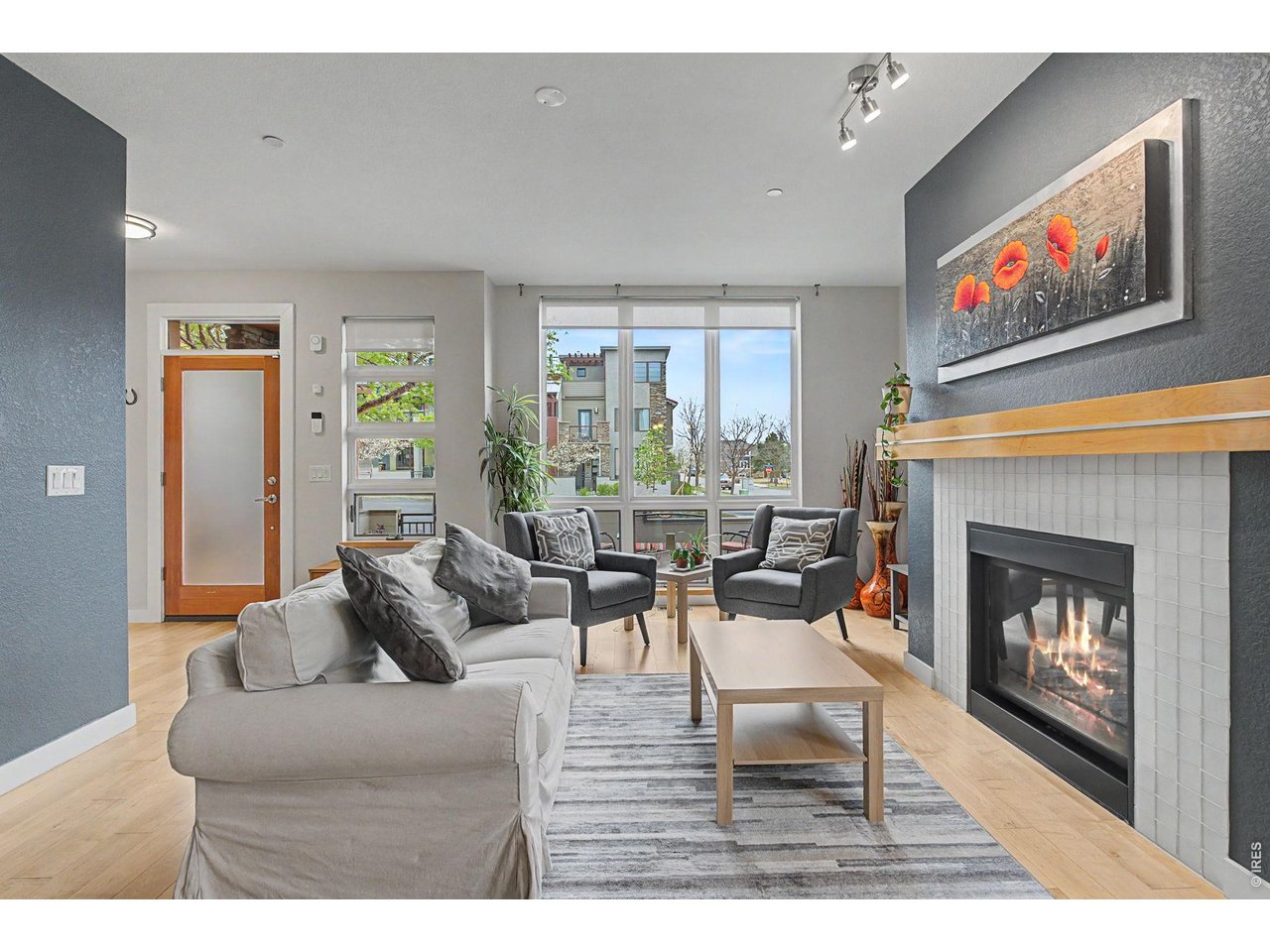 5055 Ralston Street, Unit A Boulder, CO 80304 - Photo 2 of 50 a living room with furniture a large window and a fireplace