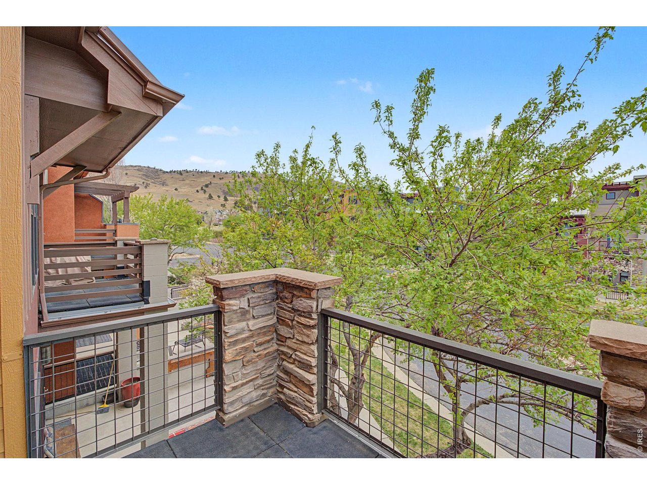 5055 Ralston Street, Unit A Boulder, CO 80304 - Photo 22 of 50 a view of a balcony with wooden floor and fence