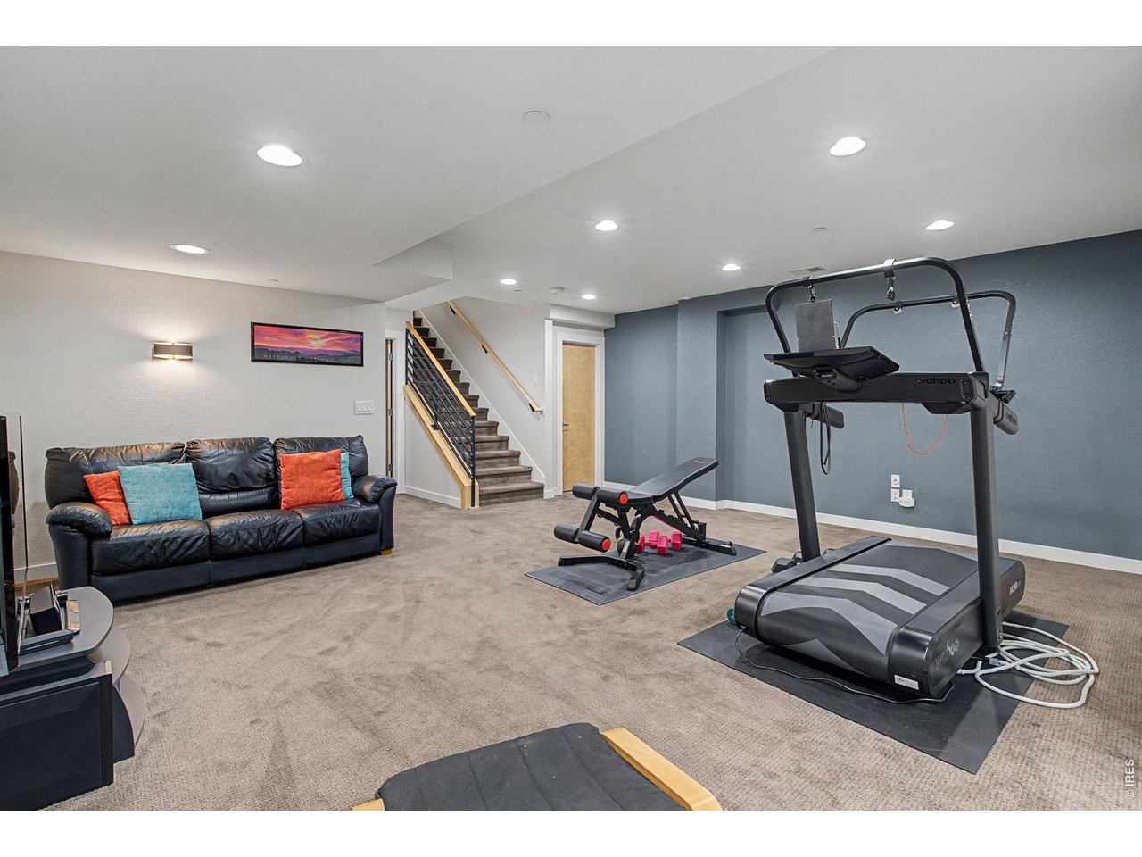 5055 Ralston Street, Unit A Boulder, CO 80304 - Photo 36 of 50 a room with gym equipment and a flat screen tv