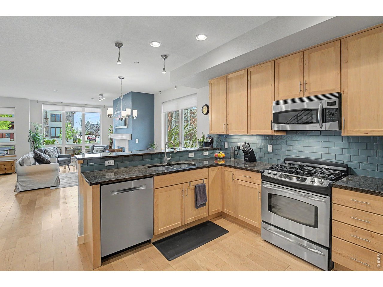 5055 Ralston Street, Unit A Boulder, CO 80304 - Photo 10 of 50 a kitchen with stainless steel appliances granite countertop a stove a sink and a microwave