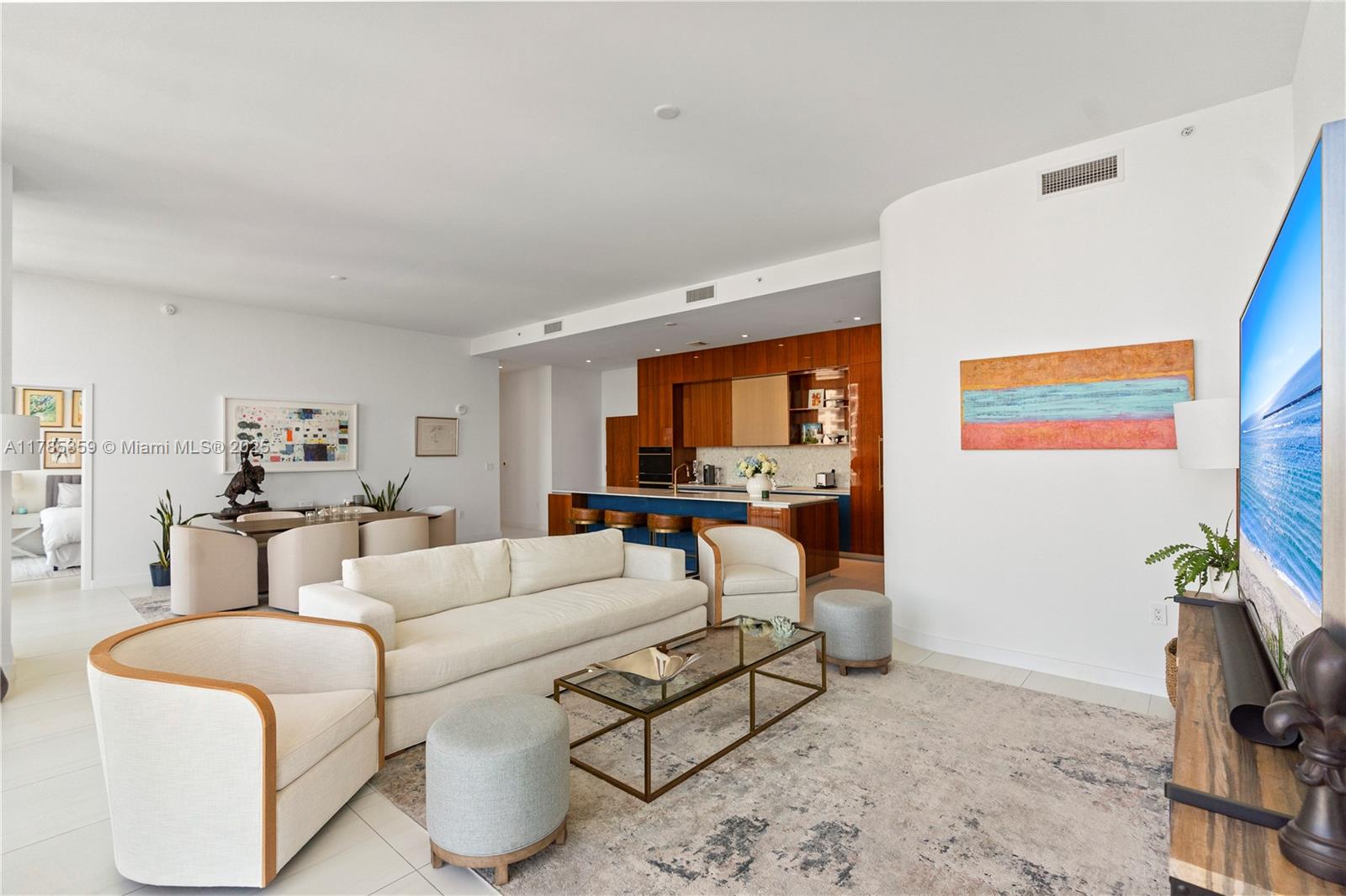 2678 Tigertail Avenue, Unit PH4 Miami, FL 33133 - Photo 1 of 75 a living room with furniture and a flat screen tv