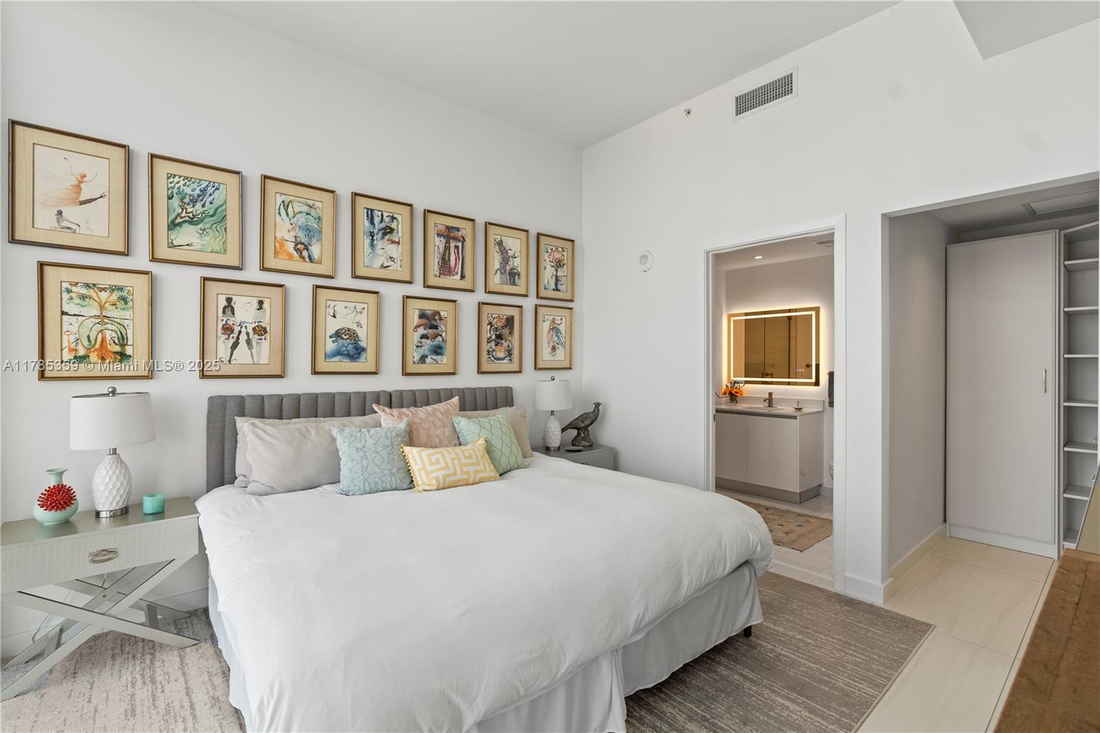 2678 Tigertail Avenue, Unit PH4 Miami, FL 33133 - Photo 16 of 75 a bedroom with a large bed and a window