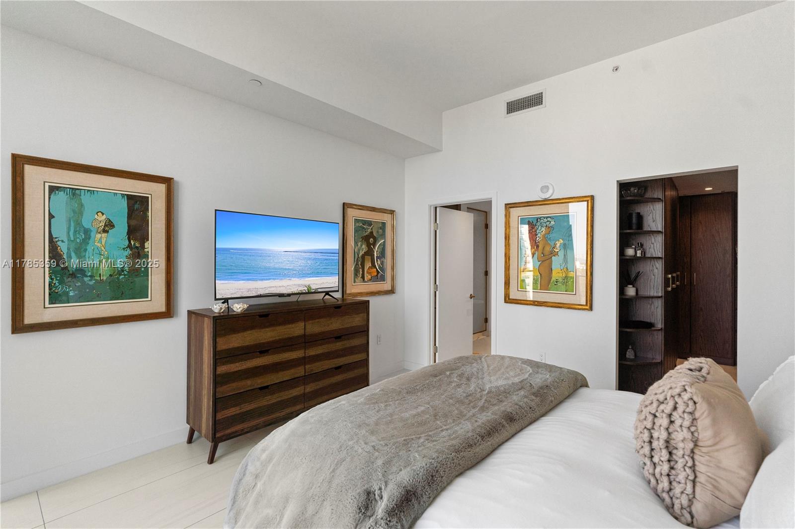 2678 Tigertail Avenue, Unit PH4 Miami, FL 33133 - Photo 18 of 75 a bedroom with a bed and a flat screen tv