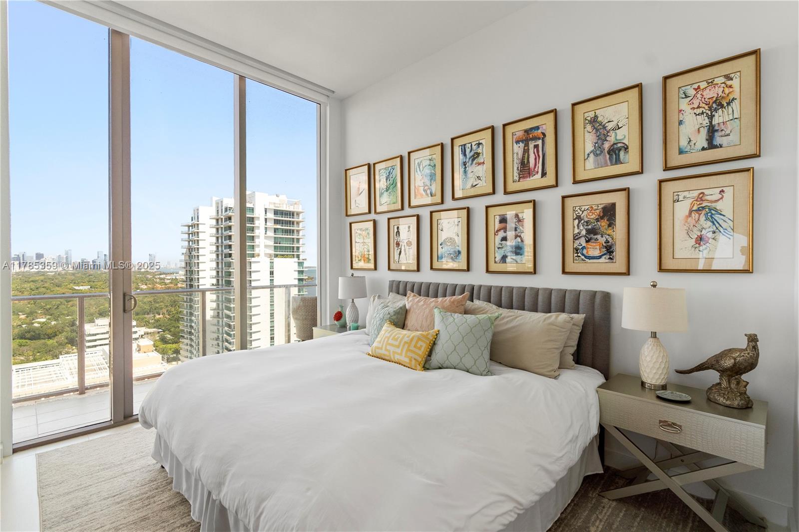 2678 Tigertail Avenue, Unit PH4 Miami, FL 33133 - Photo 20 of 75 a bedroom with a large bed and a large window