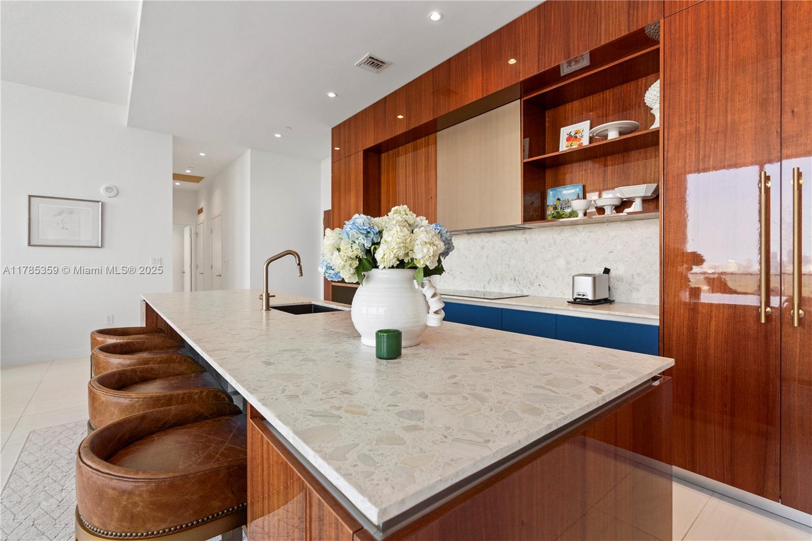 2678 Tigertail Avenue, Unit PH4 Miami, FL 33133 - Photo 2 of 75 a kitchen with stainless steel appliances granite countertop a sink and a wooden cabinets