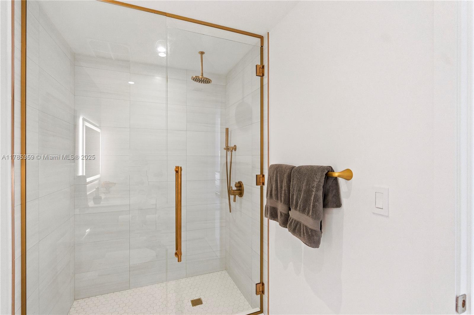 2678 Tigertail Avenue, Unit PH4 Miami, FL 33133 - Photo 28 of 75 a bathroom with a shower and a shower
