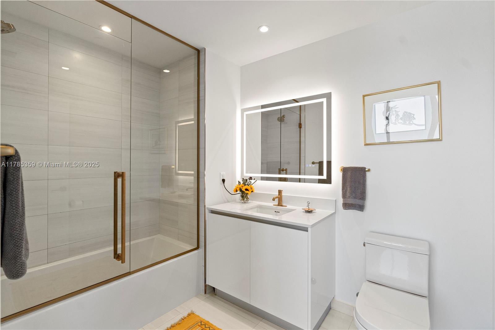 2678 Tigertail Avenue, Unit PH4 Miami, FL 33133 - Photo 29 of 75 a bathroom with a sink a toilet and shower