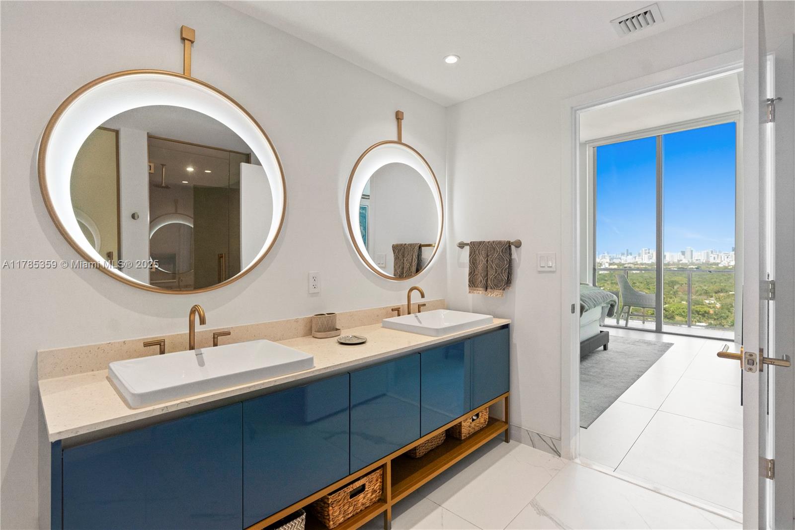 2678 Tigertail Avenue, Unit PH4 Miami, FL 33133 - Photo 31 of 75 a bathroom with a double vanity sink and a mirror