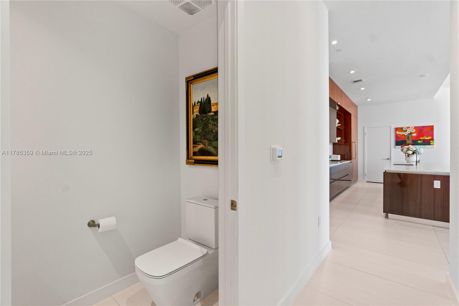 2678 Tigertail Avenue, Unit PH4 Miami, FL 33133 - Photo 33 of 75 a bathroom with a toilet and a shower