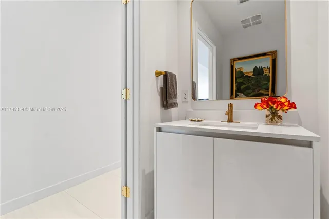 a living room with furniture a piano and a fireplace
