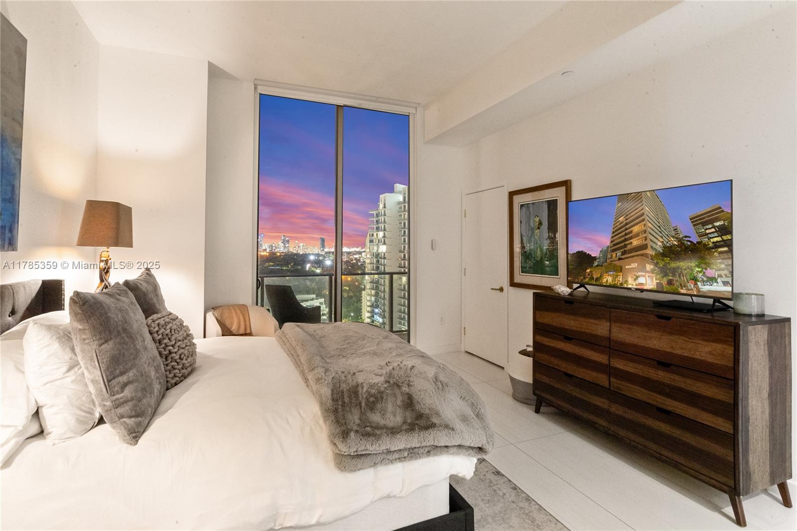 2678 Tigertail Avenue, Unit PH4 Miami, FL 33133 - Photo 62 of 75 a bedroom with a bed and a flat screen tv