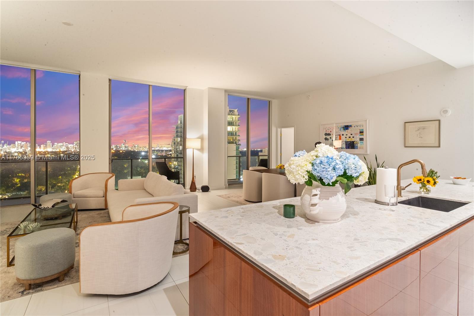 2678 Tigertail Avenue, Unit PH4 Miami, FL 33133 - Photo 68 of 75 a living room with furniture a chandelier and a table