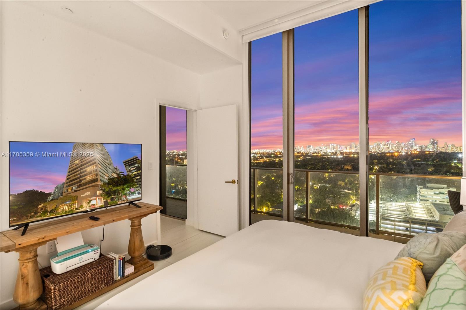 2678 Tigertail Avenue, Unit PH4 Miami, FL 33133 - Photo 72 of 75 a bed sitting in a bedroom next to a window