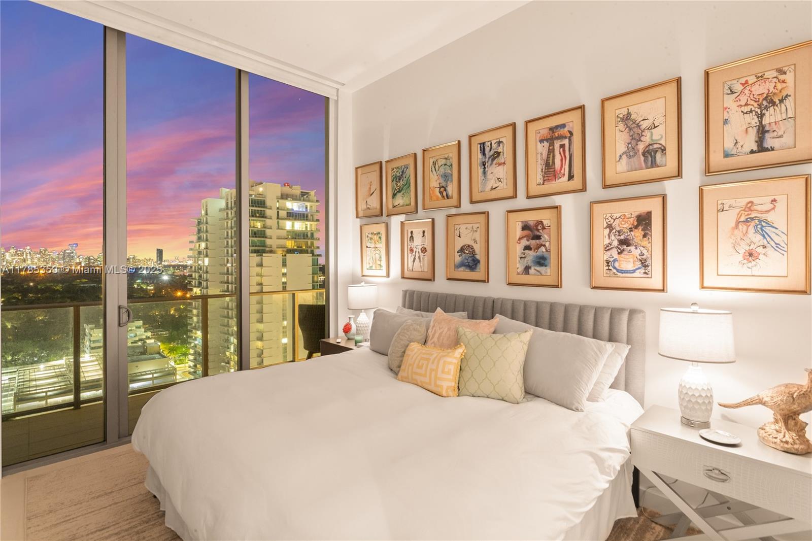 2678 Tigertail Avenue, Unit PH4 Miami, FL 33133 - Photo 73 of 75 a bedroom with a large window and a bed