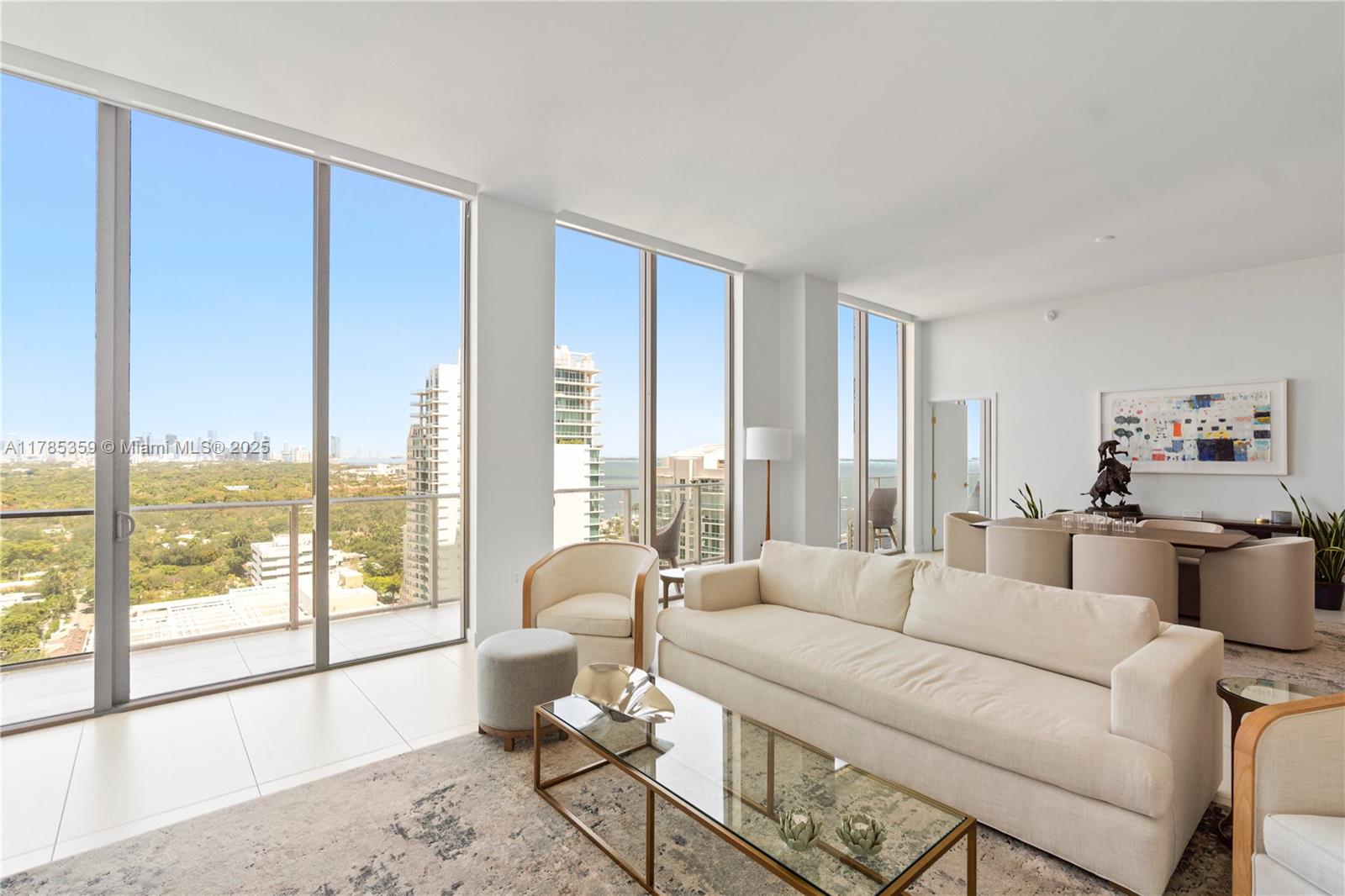 2678 Tigertail Avenue, Unit PH4 Miami, FL 33133 - Photo 10 of 75 a living room with furniture and a large window