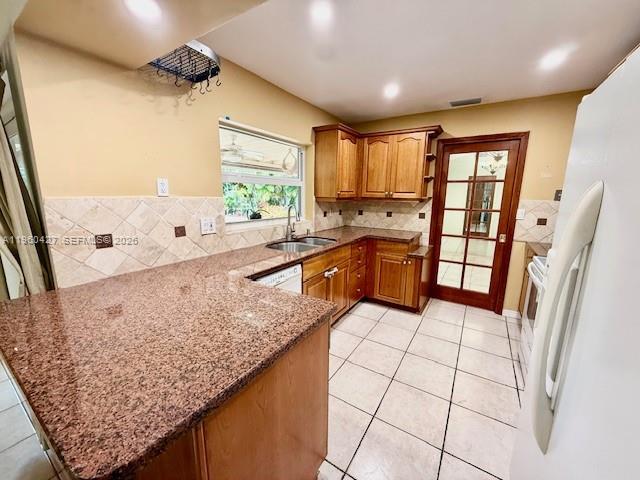 11600 Southwest 113th Place Miami, FL 33176 - Photo 20 of 21 a kitchen with stainless steel appliances granite countertop sink refrigerator and window
