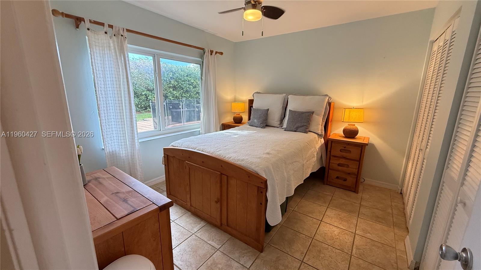 11600 Southwest 113th Place Miami, FL 33176 - Photo 4 of 21 a bedroom with a bed and a window