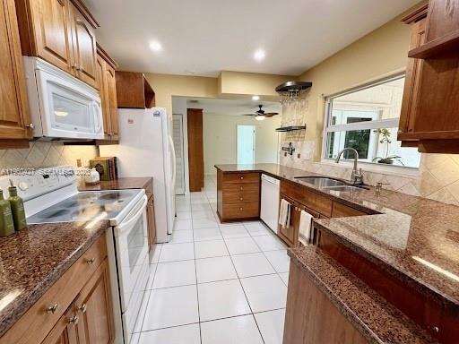 11600 Southwest 113th Place Miami, FL 33176 - Photo 7 of 21 a kitchen with stainless steel appliances granite countertop a sink stove and refrigerator