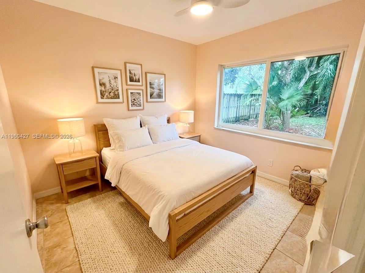 11600 Southwest 113th Place Miami, FL 33176 - Photo 10 of 21 a bedroom with a bed and a window