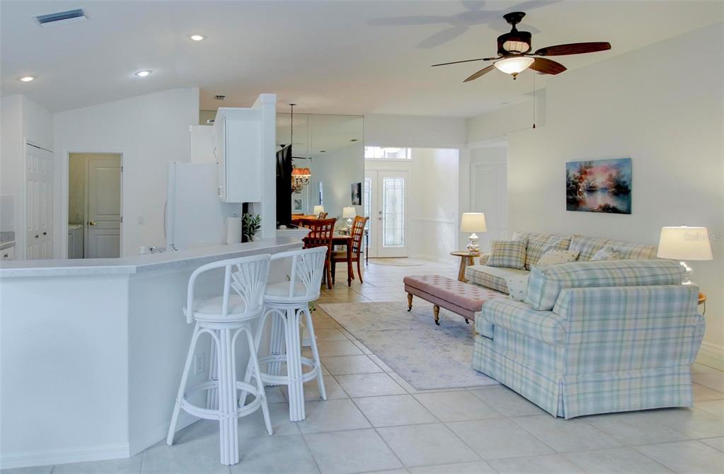 143 Braemar Avenue Venice, FL 34293 - Photo 13 of 36 a living room with furniture and a wooden floor