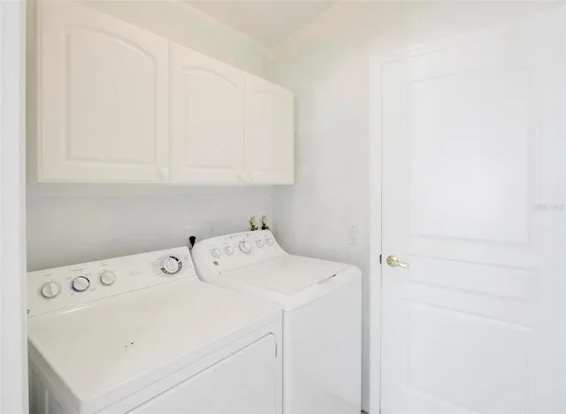 a bedroom with a bed and flat screen tv