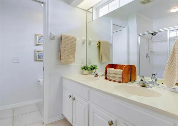 a white toilet sitting next to a white walls