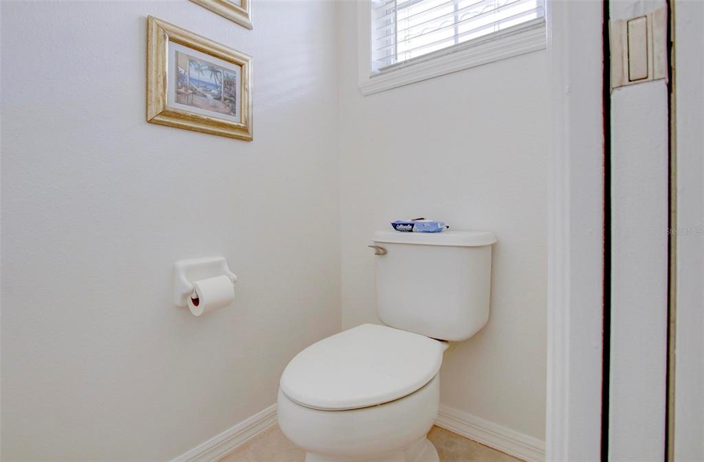 143 Braemar Avenue Venice, FL 34293 - Photo 28 of 36 a white toilet sitting next to a white walls