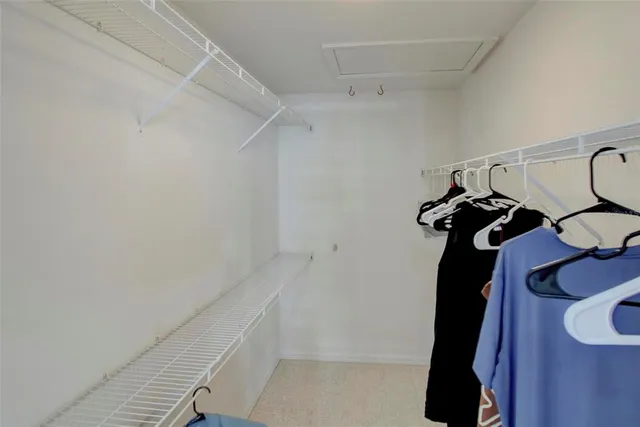 a bedroom with a bed and a mirror