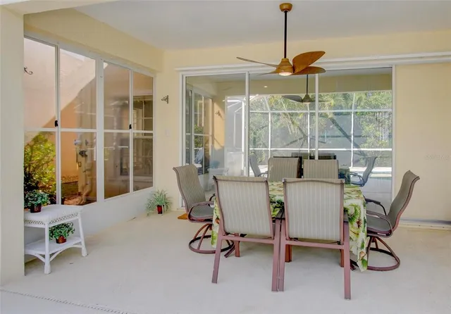 a view of a swimming pool with sitting area