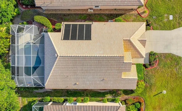 an aerial view of a house with a garden