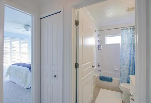 a bathroom with a shower toilet and sink