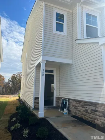 a house view with a backyard space