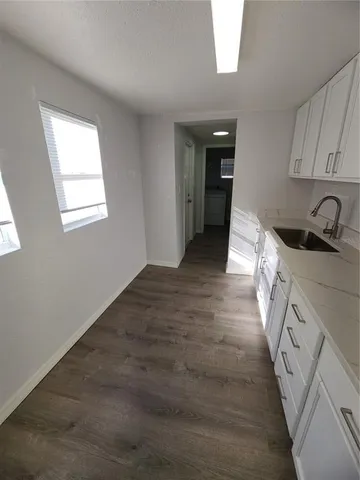 a view of a kitchen from the hallway