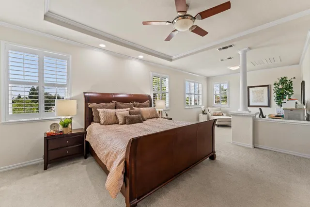 a bed room with a bed and a chandelier